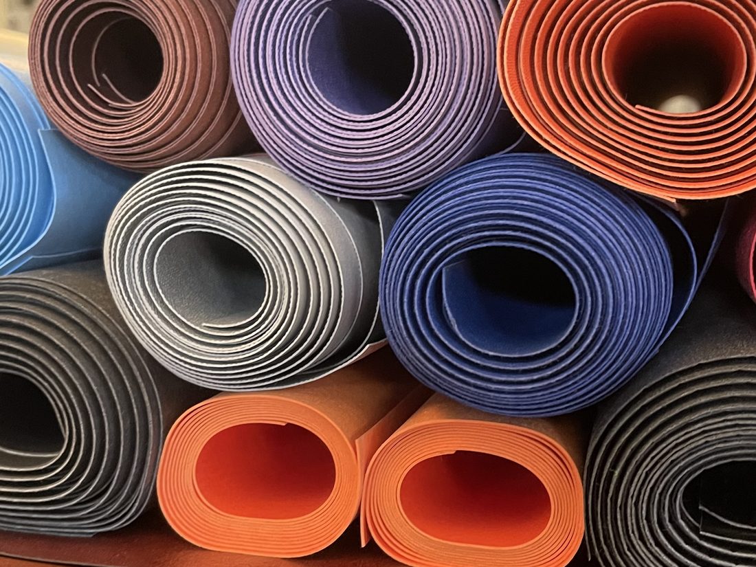 Colourful rolls of vegan leather in our workshop
